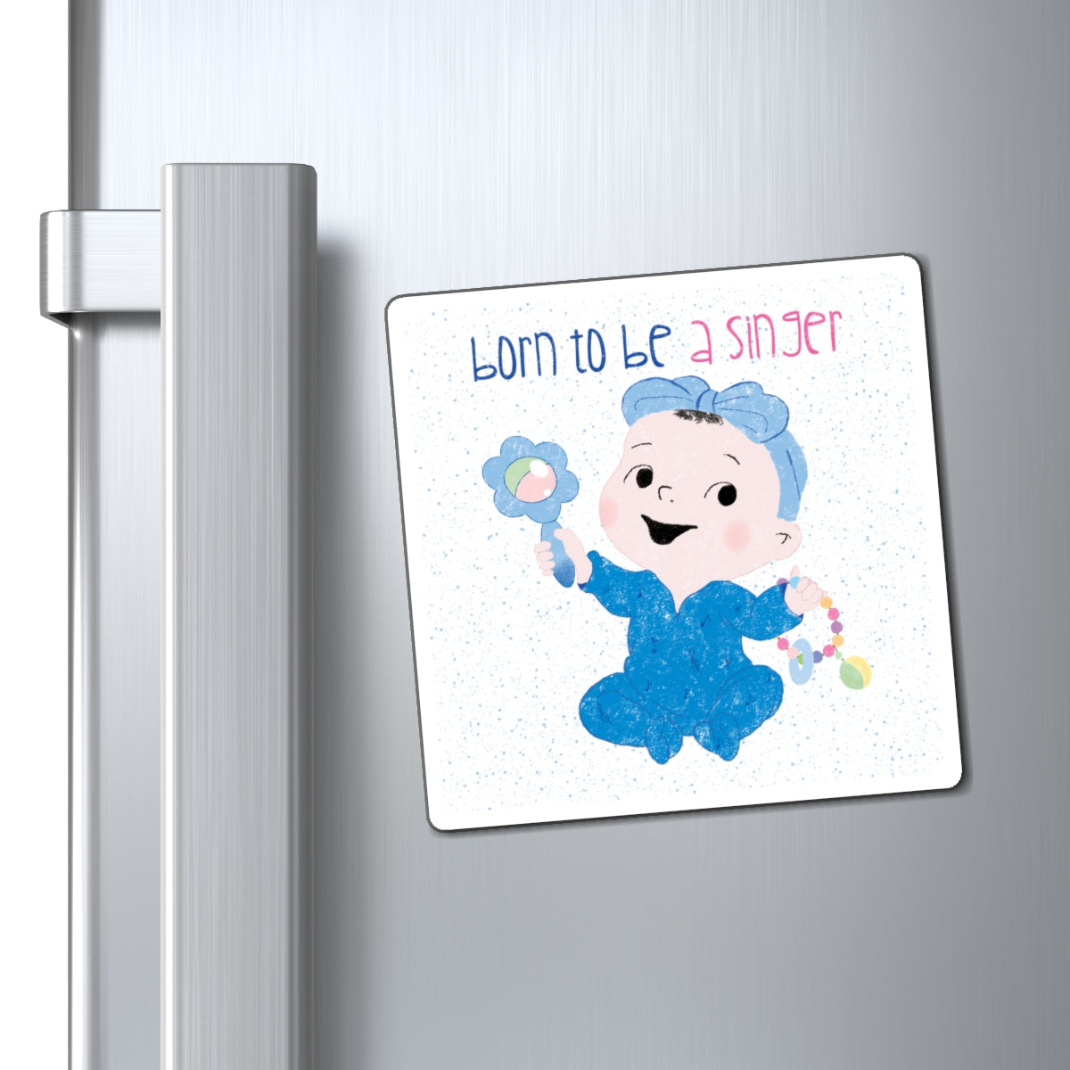 Playful nursery fridge magnet (4”x4” size) featuring a cartoon baby girl holding a rattle, with the text "Born to be a singer”, close-up, kidlic