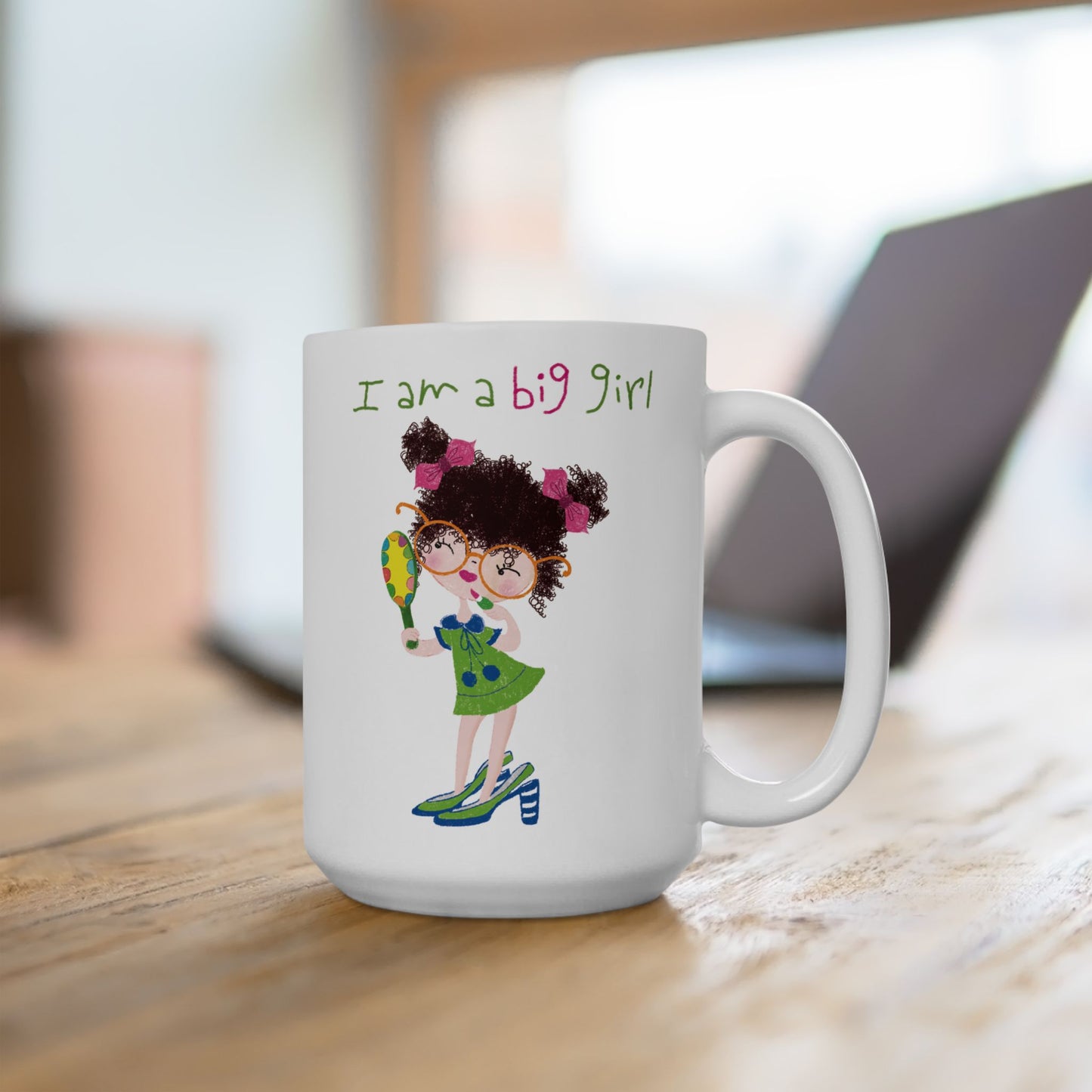 Charming funny coffee mug featuring a cartoon girl with curly hair, wearing oversized glasses, high heels, and a green dress, holding a mirror , with the text 'I am a big girl’ on a desk, 15 oz, kidlic