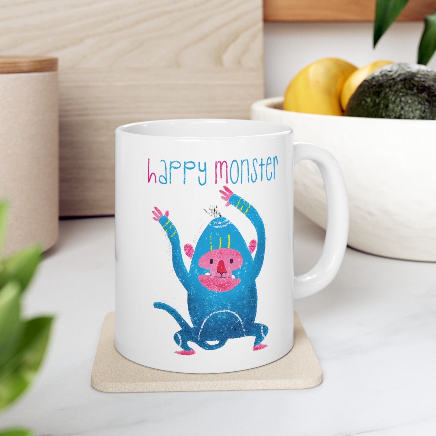 Funny coffee mug featuring smiling blue monster dancing with joy, and the text 'Happy Monsterâ on a coffee table, 11oz, free shipping, USA, kidlic