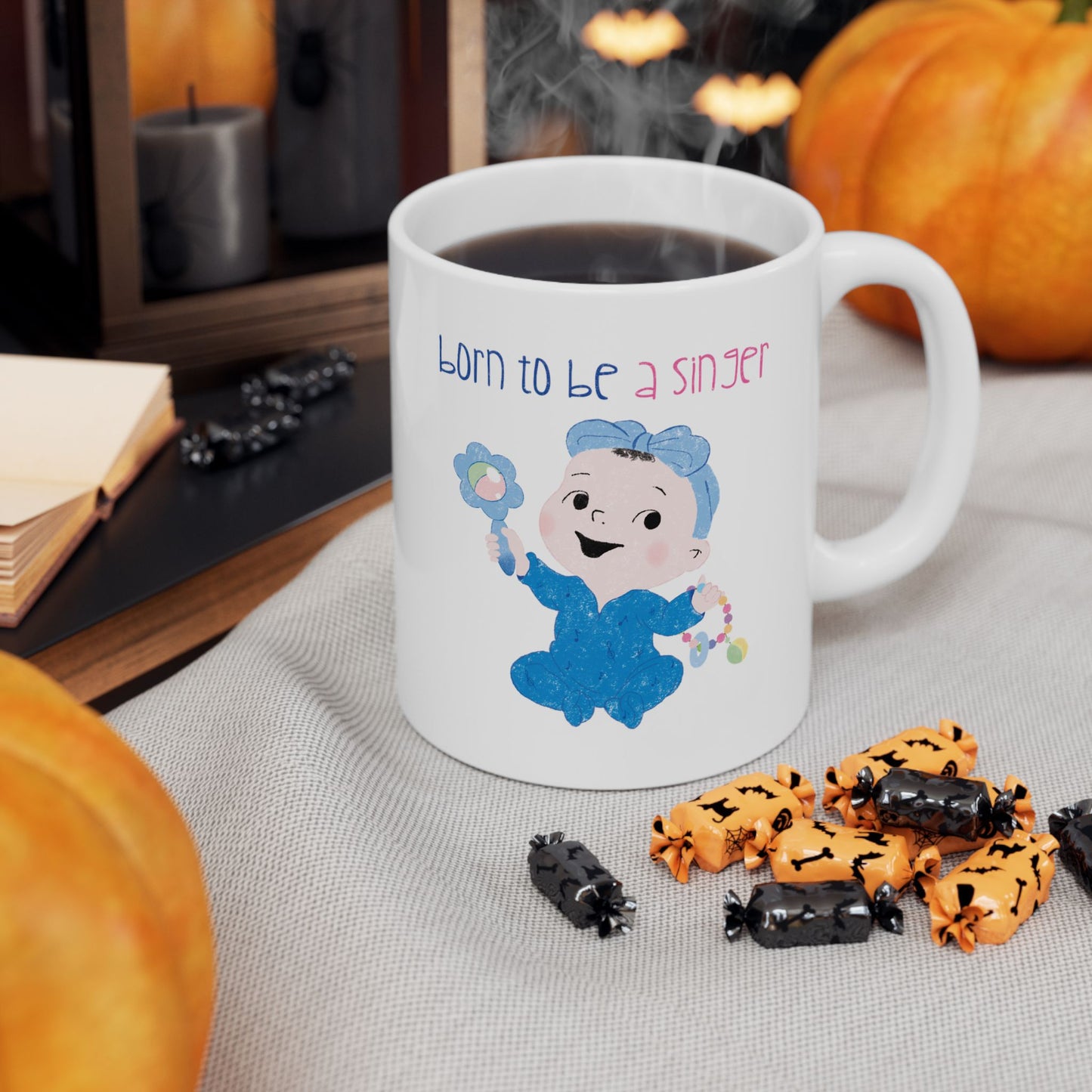Adorable nursery coffee mug featuring a cartoon baby girl holding a rattle, with the text "Born to be a singer” on a coffee table, size: 11 oz, kidlic