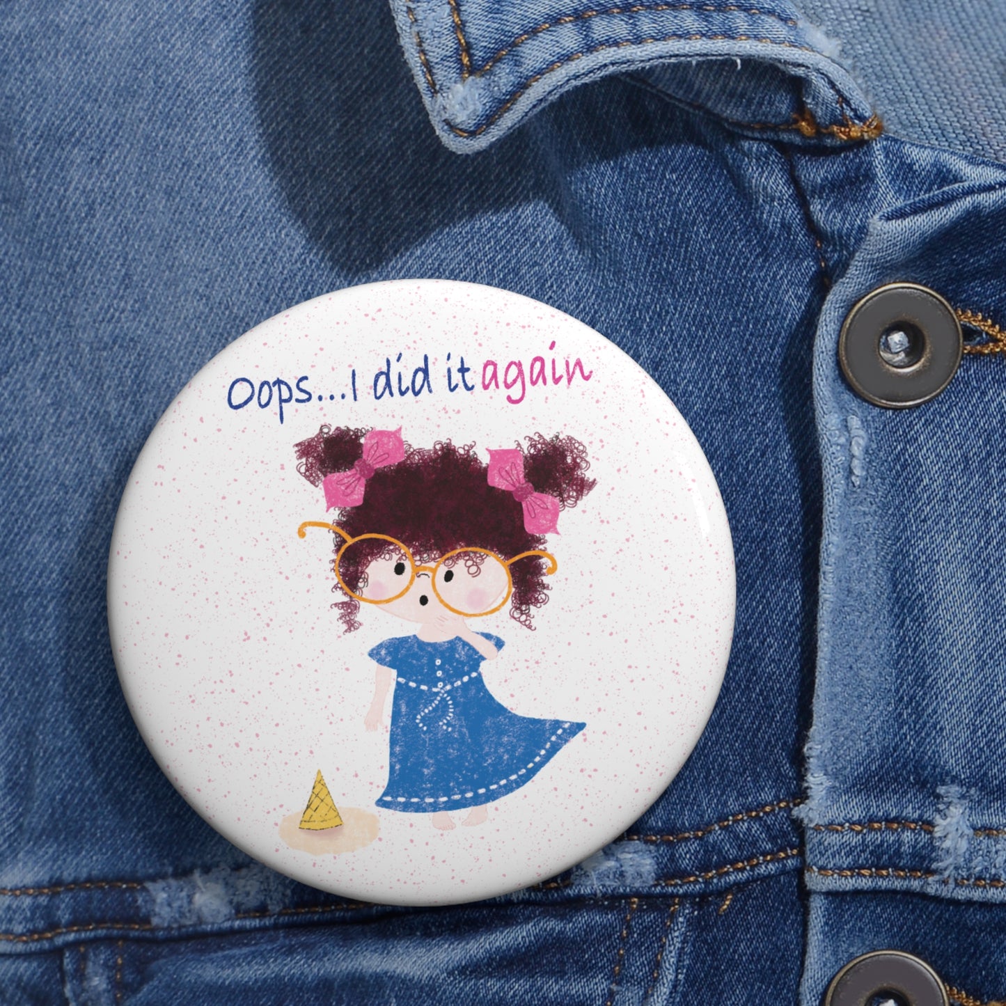 Playful nursery round pin button featuring a cartoon girl with curly hair, oversized glasses, and a blue dress, standing next to a fallen ice cream cone, with the text 'Oops... I did it againâ, size 3â, close-up, kidlic