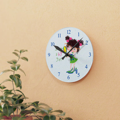 Humorous nursery acrylic wall clock featuring a cartoon girl with curly hair, oversized glasses, and a green dress, holding a mirror, with the text 'I am a big girl' alongside blue numbers on the clock face - on the wall,  size 8”x8” (square ), close-up, kidlic