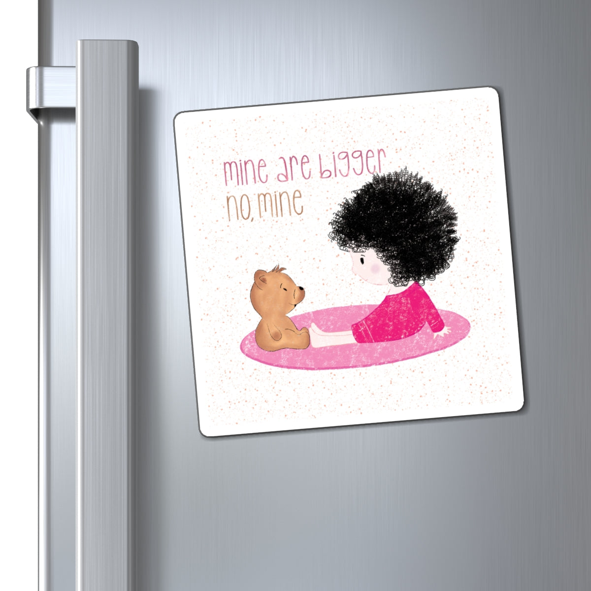 Sweet fridge magnet featuring a cartoon baby girl sitting on a pink mat, facing a brown stuffed teddy bear,  with the text 'mine are bigger, no, mine’, size 6”x6”, close-up, kidlic 