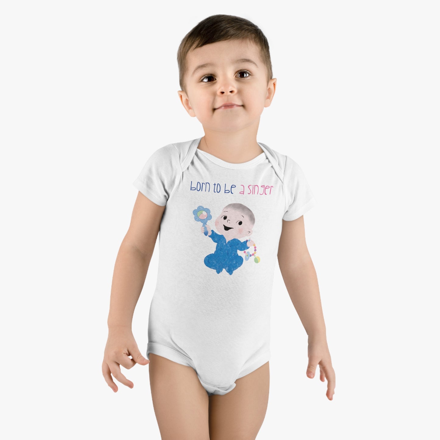 Boy wearing adorable white organic onesie featuring a cartoon baby boy holding a rattle, with the text "Born to be a singer”, free shipping, kidlic