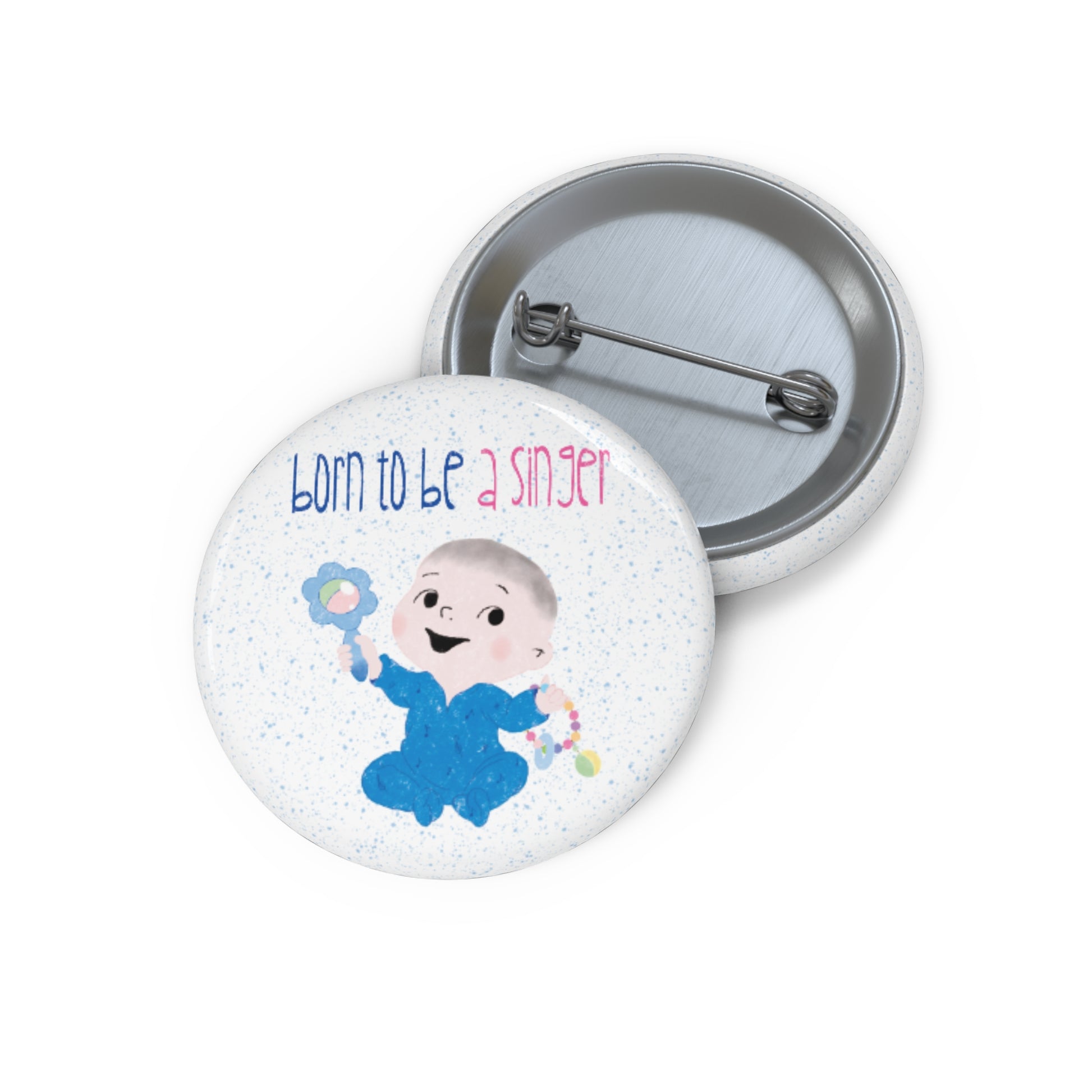 Funny baby nursery singer-themed pin button featuring a cartoon baby boy holding a rattle, with the text "Born to be a singer”, 1” size, kidlic